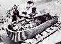 TN_HowardCarterCleans3rdCoffinOfKingTut.jpg